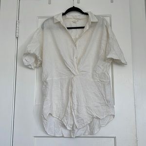 Short sleeved linen top,  twist in the middle, and waist band for defined shape